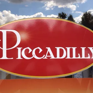 a red sign with the word piccadilly