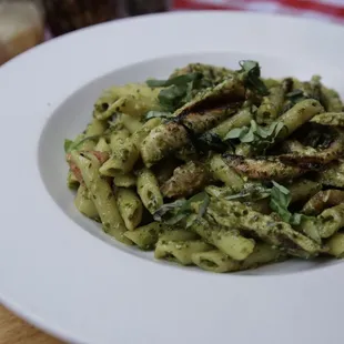 a plate of pasta with pesto