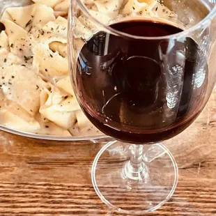 Primativo wine. Pasta with mushrooms. Pappardelle ai funghi porcini.