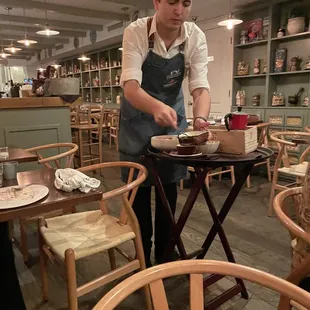 Waiter preparing our delicious tiramisu