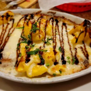 I forget the name but amazing 4 cheese stuffed pasta with chicken and blue cheese sauce.