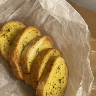 Garlic bread included with take out dinner.