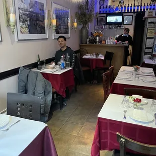 a man sitting at a table in a restaurant