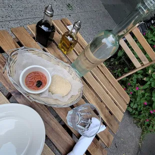 a plate of food and a bottle of wine