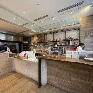 a kitchen with a counter and a bar