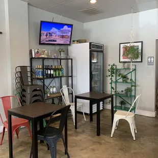 a coffee shop with tables and chairs