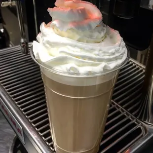 a cup of coffee with whipped cream