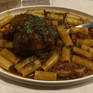 a plate of pasta and meat