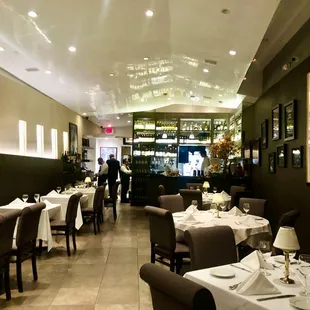 a dining area with tables and chairs