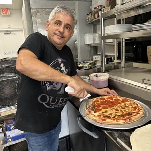 Our Chef is ready to prepare your next Pizza !!