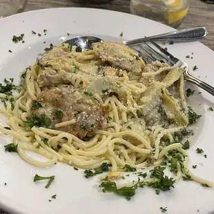 Lightly breaded veal with artichokes and capers in a lemon white wine butter sauce prepared old school