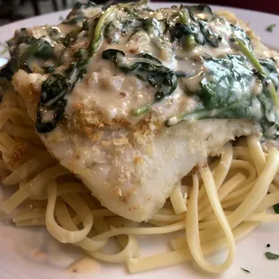 Crab encrusted haddock in white wine cream sauce