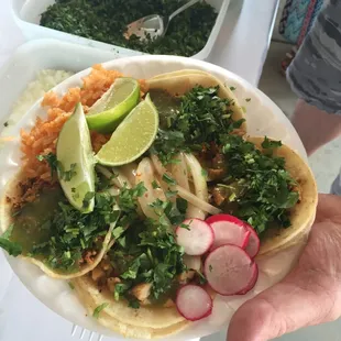 Customers preparing there tacos the way they would like. :)