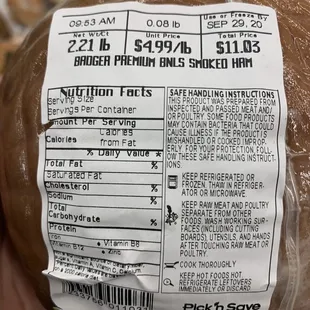 a hand holding a bagel of bread