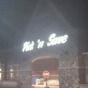 a stop sign in front of a store