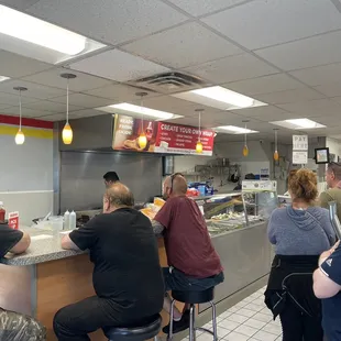 a group of people in a fast food restaurant