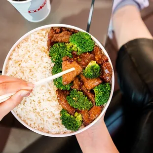 a bowl of rice and broccoli