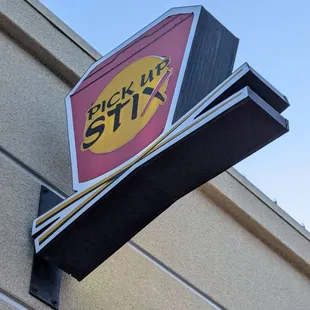 Sign hanging from the wall above the front door