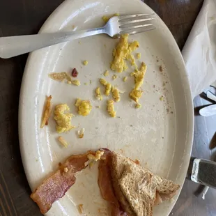 a half eaten breakfast on a plate