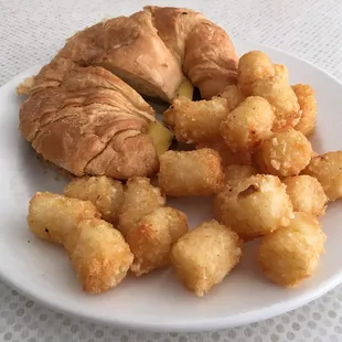 Breakfast Sandwich on Croissant, side order Tater Tots
