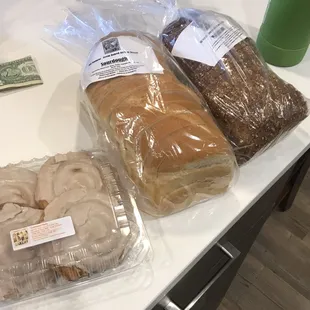 bread, doughnuts, and a dollar note