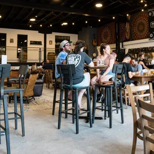 a group of people sitting at tables