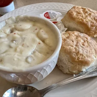 a bowl of soup and biscuits