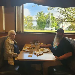 two people sitting at a table