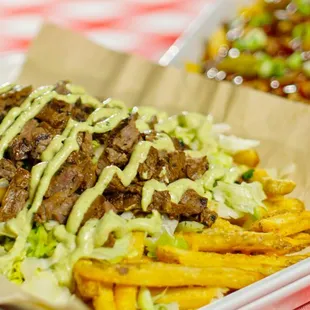 a plate of fries and a salad