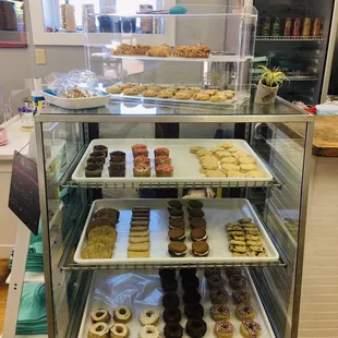 a display case filled with donuts