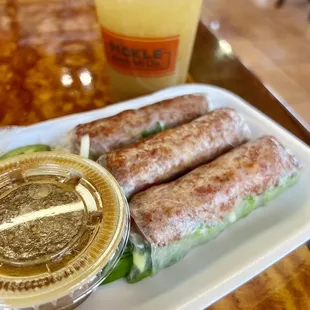 Pork Sausage spring rolls $6.5 w/ jasmine lime mint tea $4