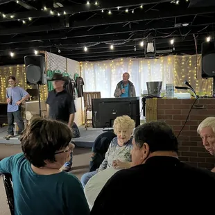 a group of people sitting around a table