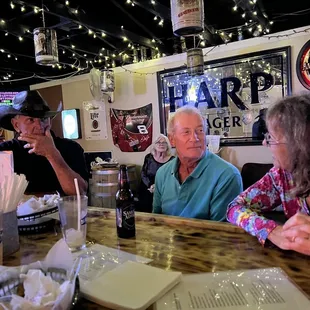 a group of people sitting at a table