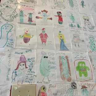 All kinds of people&apos;s pickle art adorn the walls.