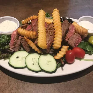 The new steak salad is absolutely delicious.