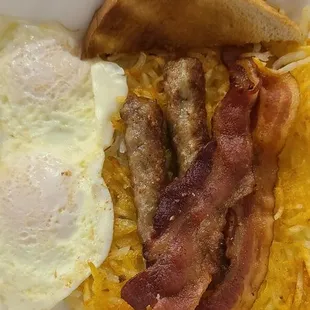 2 over easy eggs, 2 sausage links, 2 pieces of bacon and hashbrowns