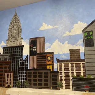 Ladies bathroom walls are painted beautifully