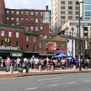 a crowd of people on a city street