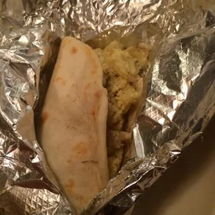 a burrito wrapped in aluminum foil