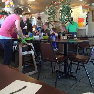 Order first before sitting, no table orders.  Happy folks will help you with your selection