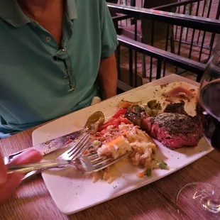 Delmonica with loaded potatoes and grilled peppers