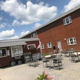 a man standing in front of a food truck