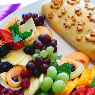 Baked brie en brioche with fresh fruit.