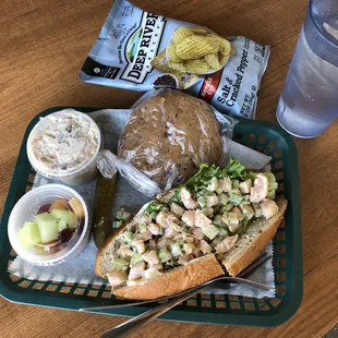 Shrimp Salad Sandwich box lunch with Chocolate Chip Pecan cookie, chips, pickle and fruit cup. The chicken salad was a different order.