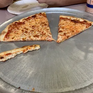 a man eating a slice of pizza
