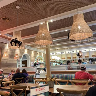 people sitting at tables in a restaurant