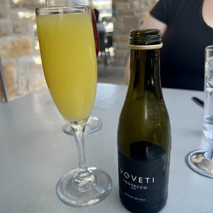 a glass of wine and a bottle of wine