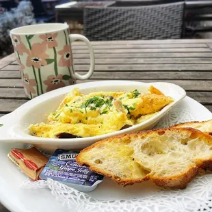 a plate of food and a cup of coffee