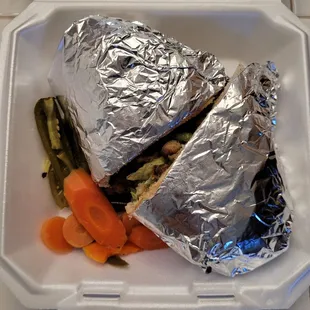 a sandwich and vegetables