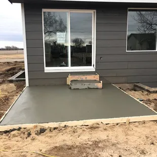 a concrete patio being poured with concrete